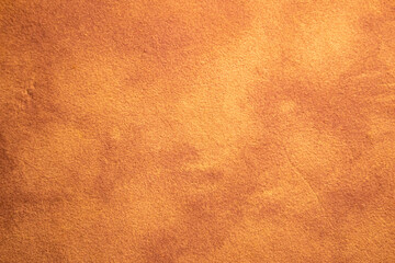Bright orange texture or background of smooth fabric material