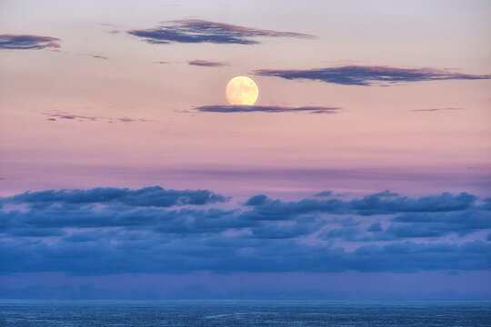 Sunset lit full moon