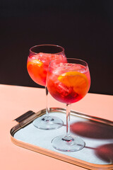 Spritz veneziano, an aperitif cocktail with Prosecco, bitter, soda, ice and red orange, pop art style. Surreal atmosphere