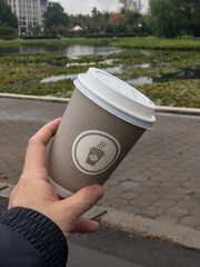 person holding a cup of coffee