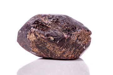 Macro of a mineral garnet stone on a white background