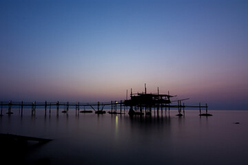 Obraz premium view of a Trabocco at sunrise