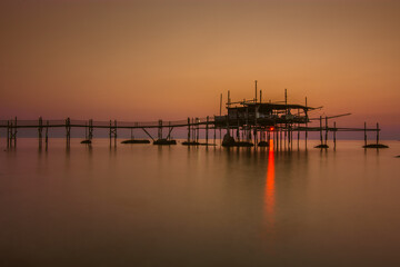 Obraz premium view of a Trabocco at sunrise