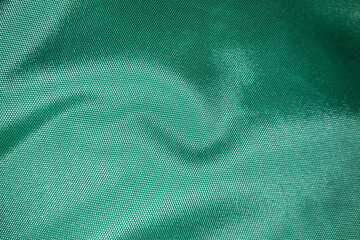 close up of polyester textured green synthetical background