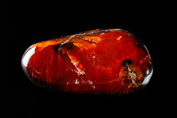 Macro mineral stone Cornelian on a black background