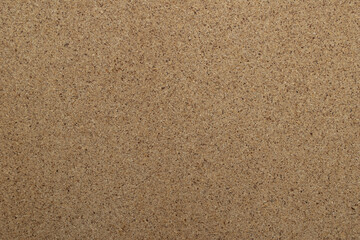 Fototapeta na wymiar Blank brown textured cork- board closeup background