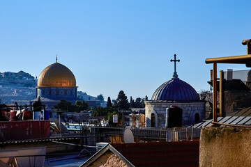 Fototapeta na wymiar sunrise over Dome of the Rock, Temple Mount, and the ancient rooftops of the old city of Jerusalem, Israel.