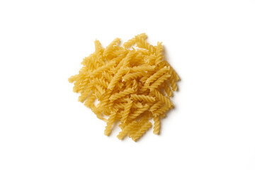 Top view of heap of raw fusilli pasta isolated on white background