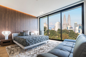 Modern and contemporary bedroom with white ceiling and wood accents with views of Kuala Lumpur...