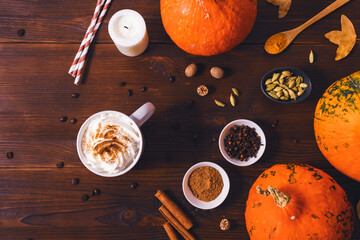 Pumpkin spice latte in mug with whipped cream