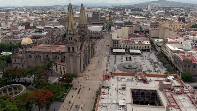 Drone Flying Over City Hall Near Rotonda de los Jaliscienses Ilustres, Guadalajara Cathedral And Main Square In Guadalajara, Jalisco, Mexico. - aerial forward