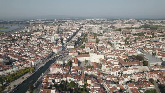 Panoramic view of sprawling Aveiro city and urban canals of Ria de Aveiro. Aerial wide shot
