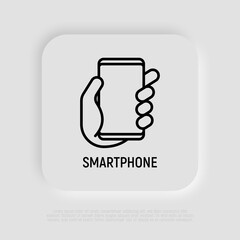 Smartphone in hand thin line icon. Modern vector illustration.