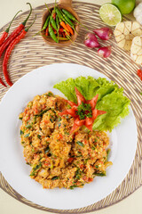 shrimp or prawn with salted egg sauce plated on a white plate and ingredients