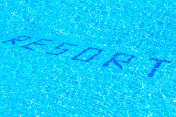 the inscription resort on the bottom of the pool with clear blue water
