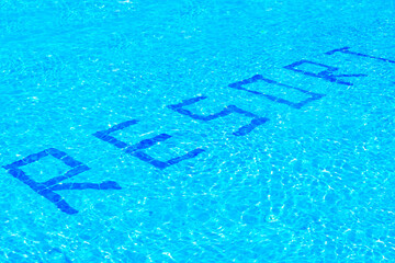 the inscription resort on the bottom of the pool with clear blue water