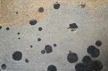 Engine oil dripped onto the cement floor.