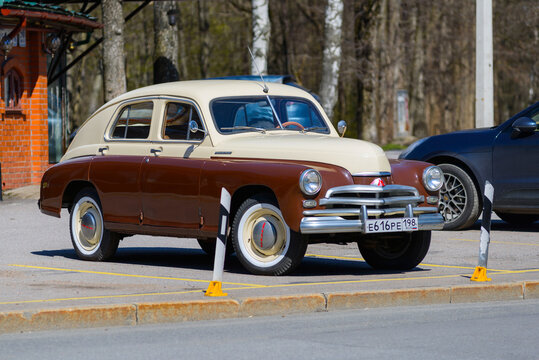 Zelenogorsk, Russia, May 9, 2021-Great looking GAZ-20 (M-20), aka Pobeda on sunny day in May. Fully restored two-colored car, brown and beige, with a lot of chrome details and white painted wheels.