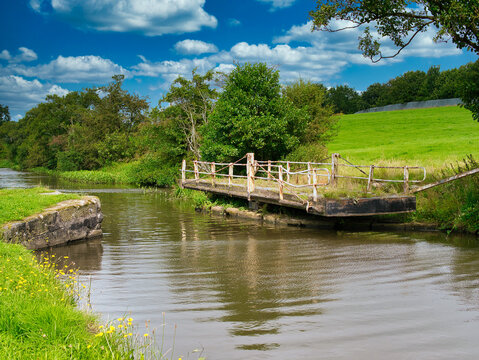 A derelict, disused swing bridge on the Leeds to Liverpool canal in Lancashire, England, UK