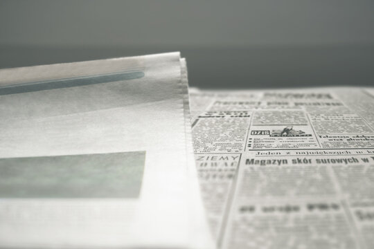 Newspaper with news or reports. News, a place for a picture or text. Soft selective selective focus, texture and texture of newspaper, close-up