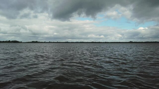 Big lake with water and clouds at the Weerribben-Wieden National Park in Overijssel the Netherlands