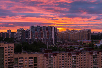 Fototapeta na wymiar Saint Petersburg, Russia-June 13, 2021: Residential quarters in a residential area of St. Petersburg at sunset. Apartment buildings in the rays of the setting sun