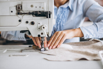 Woman tailor working at the sewing factory