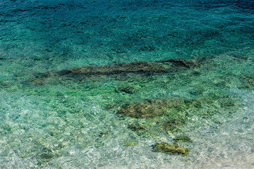 Clear green water on the beach