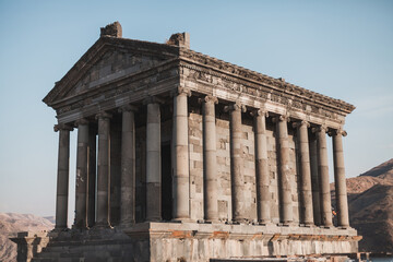 Obraz premium Ancient stone building with columns in Armenia. Historical heritage of Armenia. Old architecture. Sights of Europe.