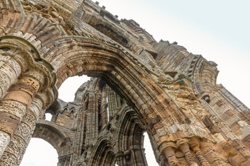 Ruins of  Whitby Abbey, a 7th-century Christian monastery that later became a Benedictine abbey.  - obrazy, fototapety, plakaty
