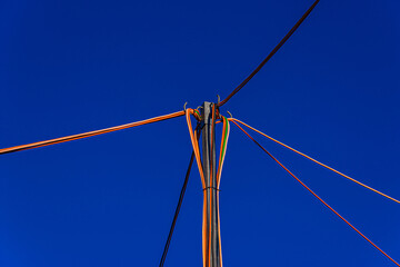 Serene view of the electrical network wires on a clear blue sky - obrazy, fototapety, plakaty