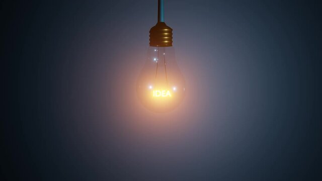 IDEA text inside of hanging and glowing 3D light bulb concept rendering animation. Loop of tungsten light bulb with idea text inside.
