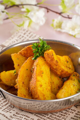 Potato wedges are irregular wedge-shaped slices of potato, often large and unpeeled, that are either baked or fried. They are sold at diners and fast food restaurants.