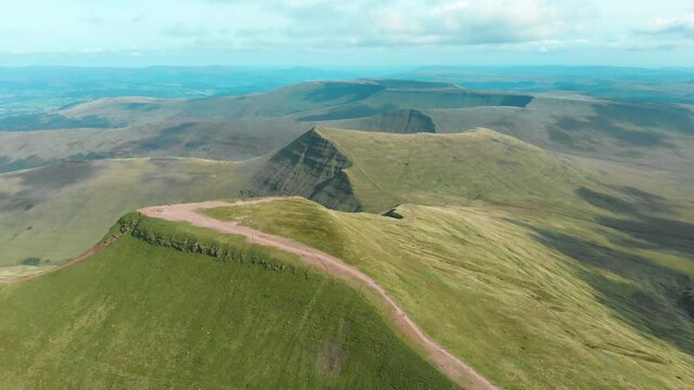Aerial drone shot of Pen Y Fan and Cribyn mountain peaks in Brecon Beacons National Park, Wales