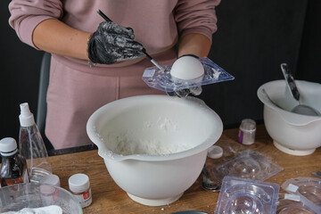 handmade bath bombs process. Preparation of bath bombs. Ingredients and floral decor on a wooden vintage table.