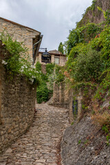 Fototapeta na wymiar Crestet narrow street of typical provencal old town, medieval village in Vaucluse, France, Europe