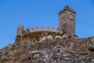 The tower of the castle. Exterior view of the castle in Folgosinho, Portuguese tourist village.