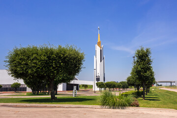 Nice looking abandoned church with a tall tower in urban area. Location is Irving, Texas