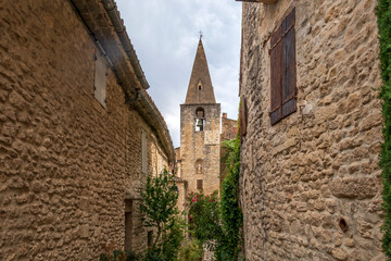 Fototapeta na wymiar Crestet narrow street of typical provencal old town, medieval village in Vaucluse, France, Europe