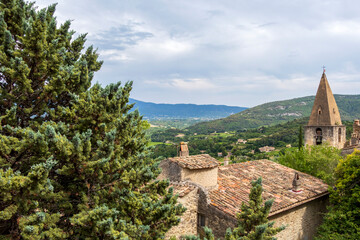Fototapeta na wymiar Red rooftops of Crestet medieval village, typical mountain view of old town in Provence, France