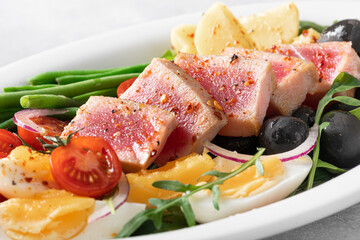 nicoise salad with fresh tuna, french cuisine, selective focus, close-up