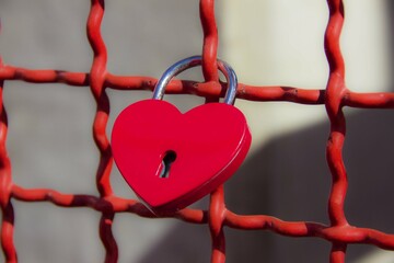 red love heart lock on a red fence