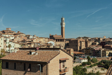 High angle view of the city of Siena. In the backgorund: Torre del Mangia (Mangia tower). Tuscany, Italy