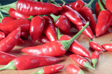 Chili pepper on a gray wooden background. Selective focus.