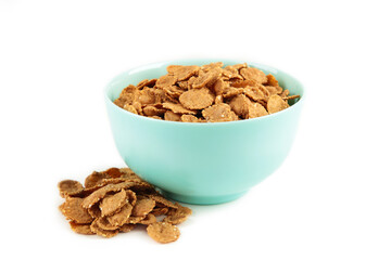 Crispy corn flakes in bowl isolated on white background.