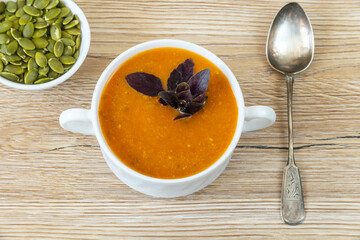 Bowl of pumpkin soup. Close up