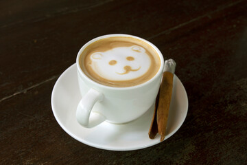 cup of hot coffee placed on a wooden table in the morning