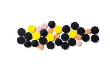 Pills. Multi-colored pills on an isolated white background. Healthcare and medicine.