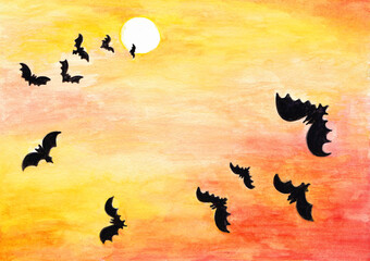 Halloween, bats on the background of the moon and red-yellow sky
