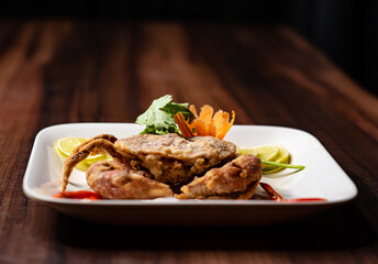 deep-fried red crab with salad on white plate  